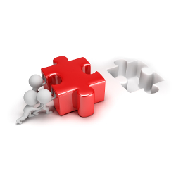 IT Integration Specialists setting a piece of a puzzle right in place.